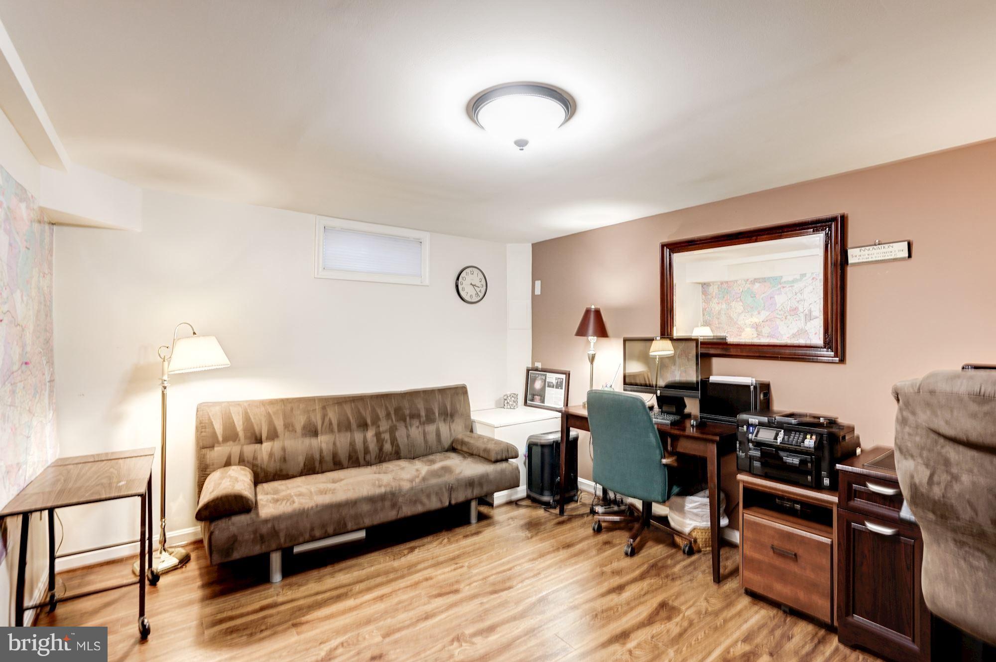 2104 Salt Kettle Way Reston, VA 20191 - Photo 24 of 29 a living room with furniture and wooden floor