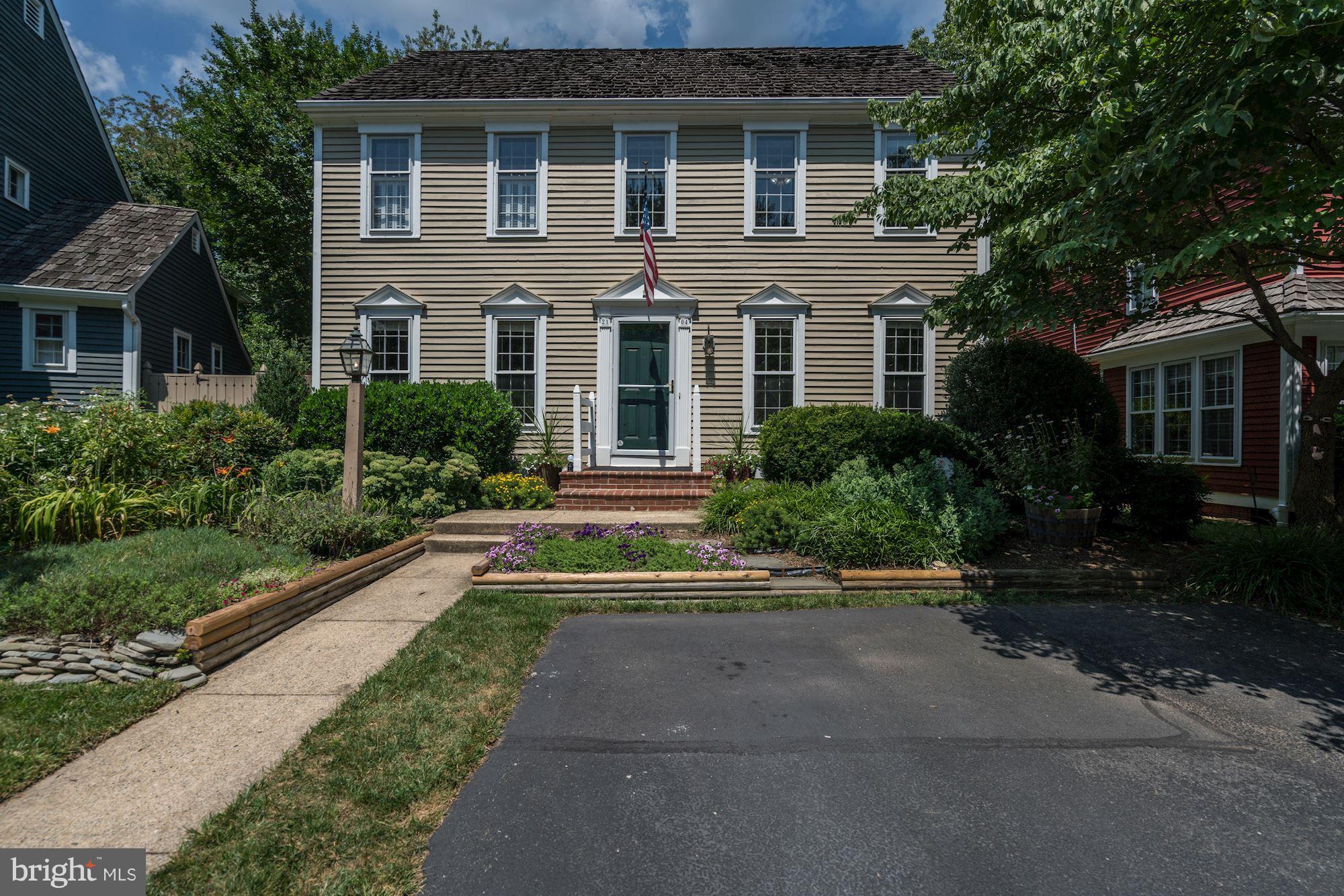 2104 Salt Kettle Way Reston, VA 20191 - Photo 29 of 29 a front view of a house with a yard and trees