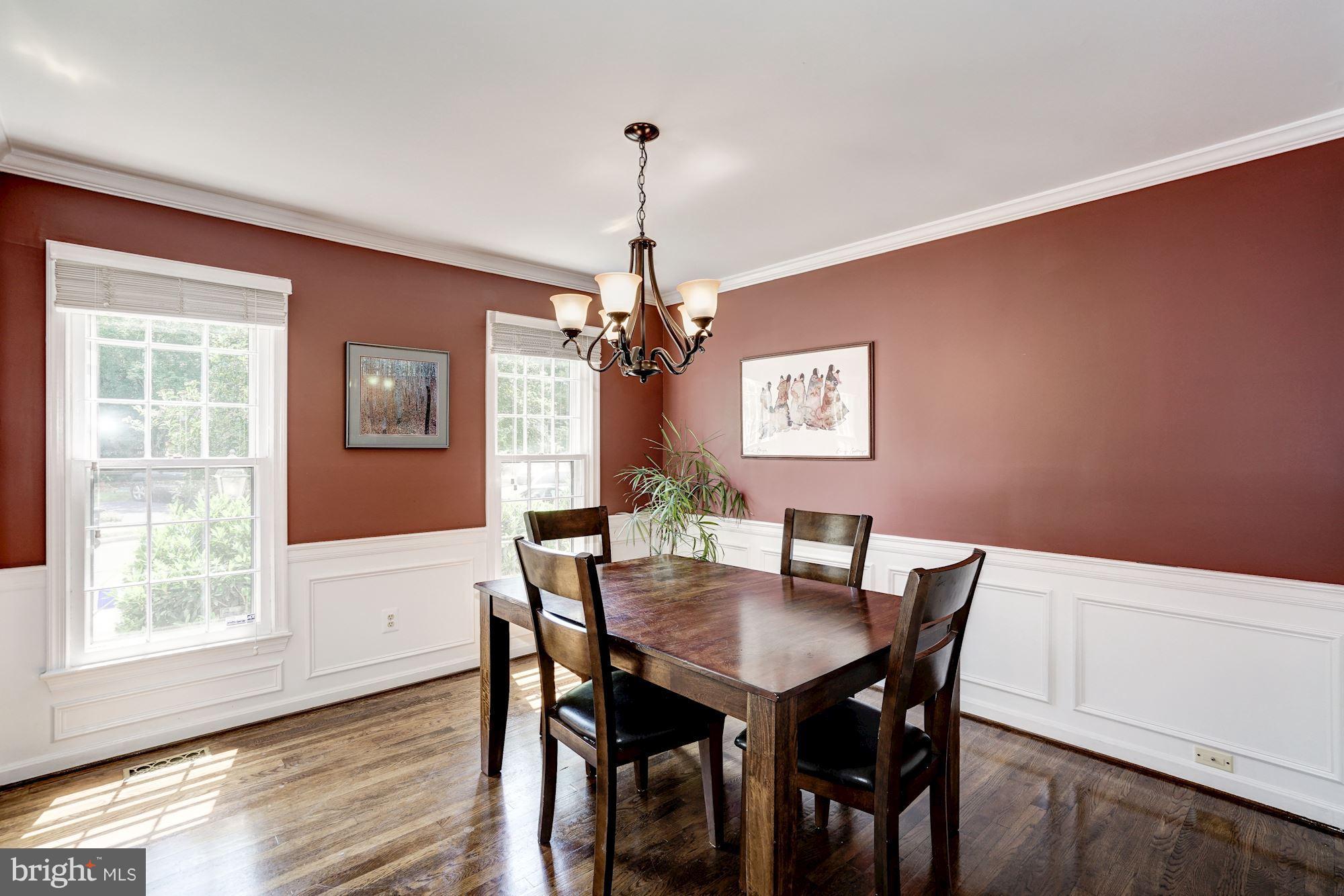 2104 Salt Kettle Way Reston, VA 20191 - Photo 6 of 29 a view of a dining room with furniture window and wooden floor