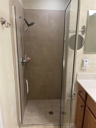 a bedroom with bed and a chandelier