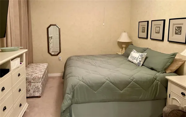 a bathroom with a sink vanity mirror and toilet