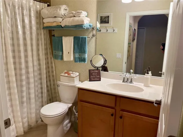 a view of kitchen with furniture and chandelier