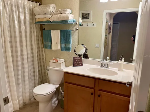 a view of kitchen with furniture and chandelier