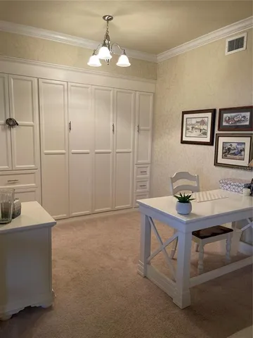 a bedroom with a bed and wall painting