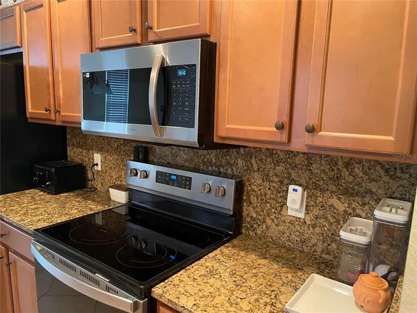 a kitchen with a stove and a microwave