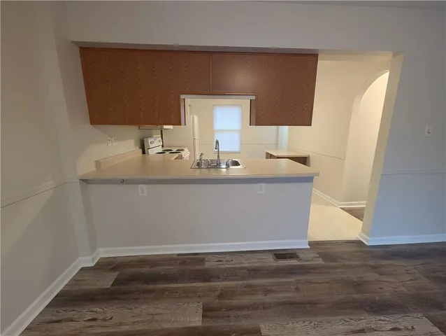 a view of cabinet with wooden floor