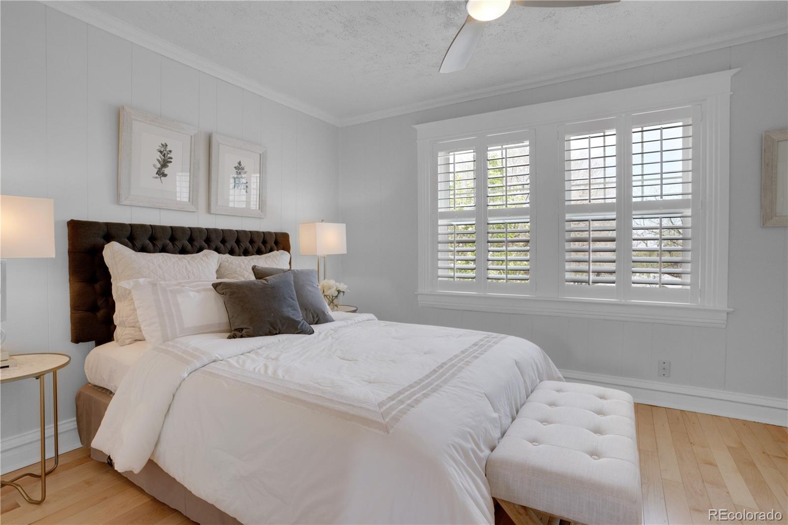 1283 Madison Street Denver, CO 80206 - Photo 15 of 34 a bedroom with a bed and a window
