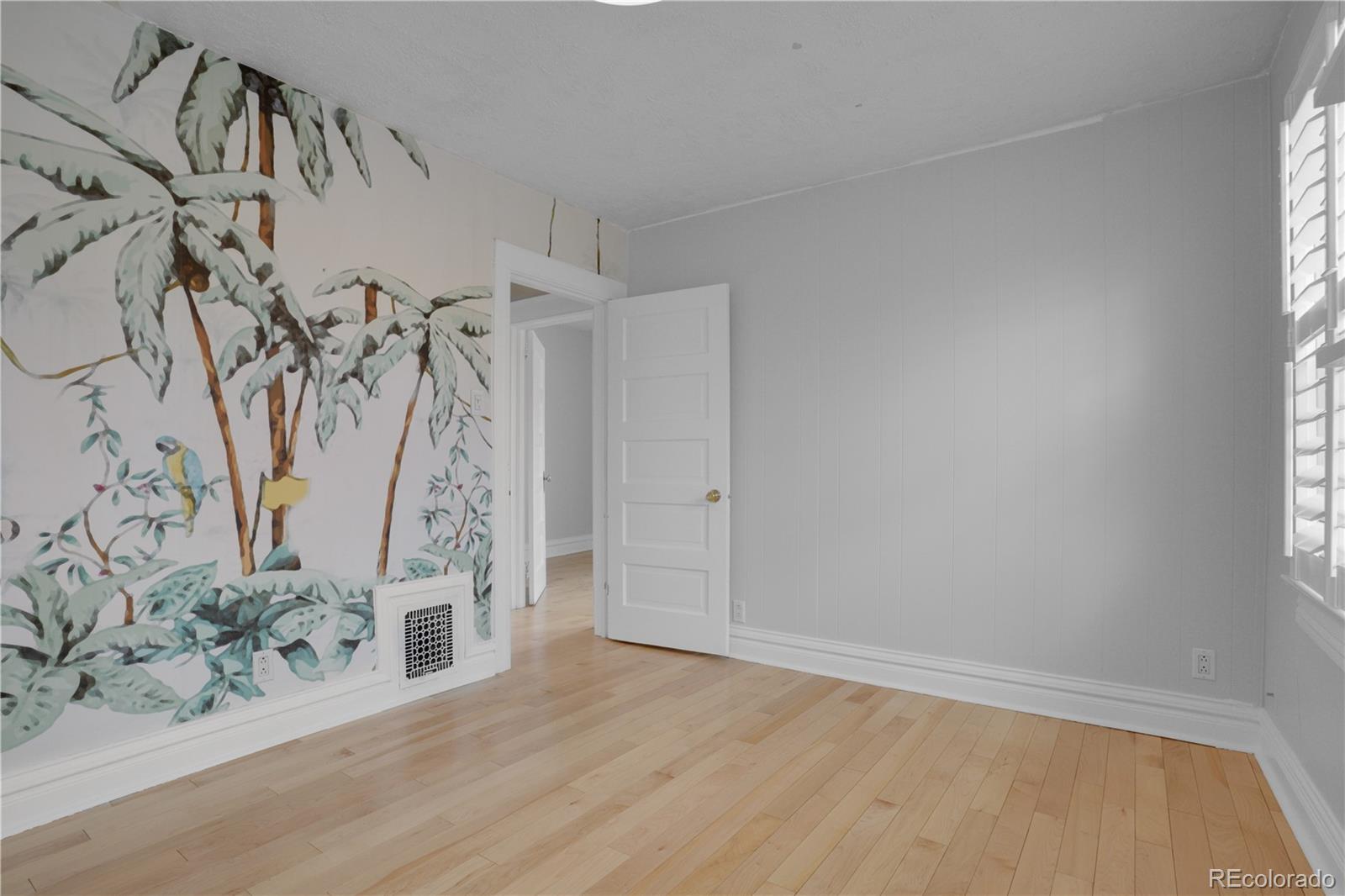 1283 Madison Street Denver, CO 80206 - Photo 17 of 34 a view of a room with wooden floor
