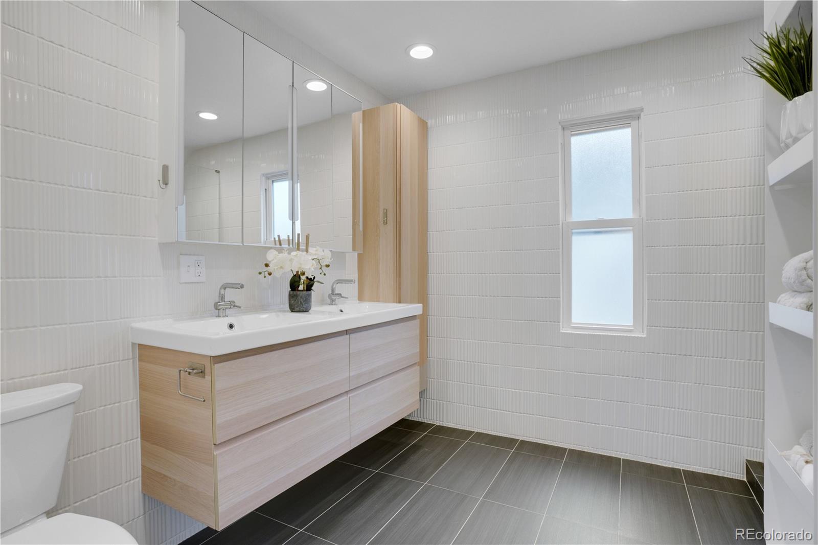 1283 Madison Street Denver, CO 80206 - Photo 18 of 34 a view of bathroom with dual sinks