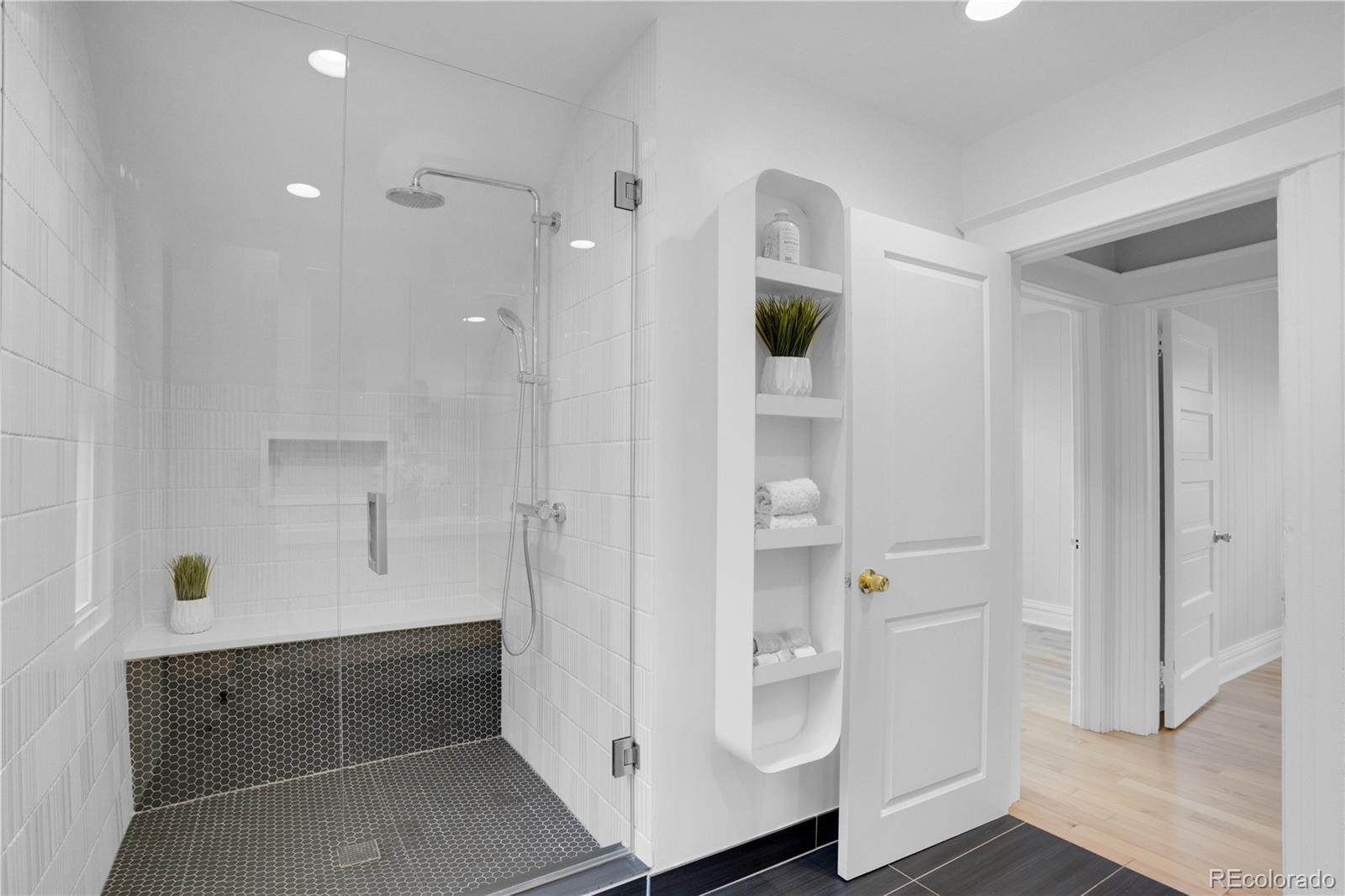 1283 Madison Street Denver, CO 80206 - Photo 20 of 34 a bathroom with a tub and shower