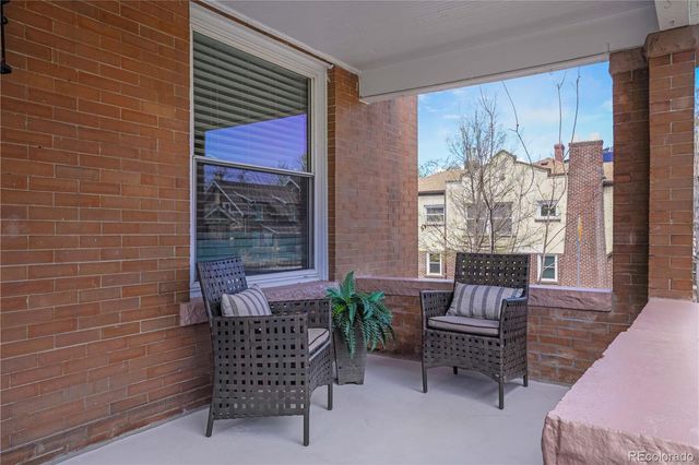 a view of a room with chairs and a potted plant