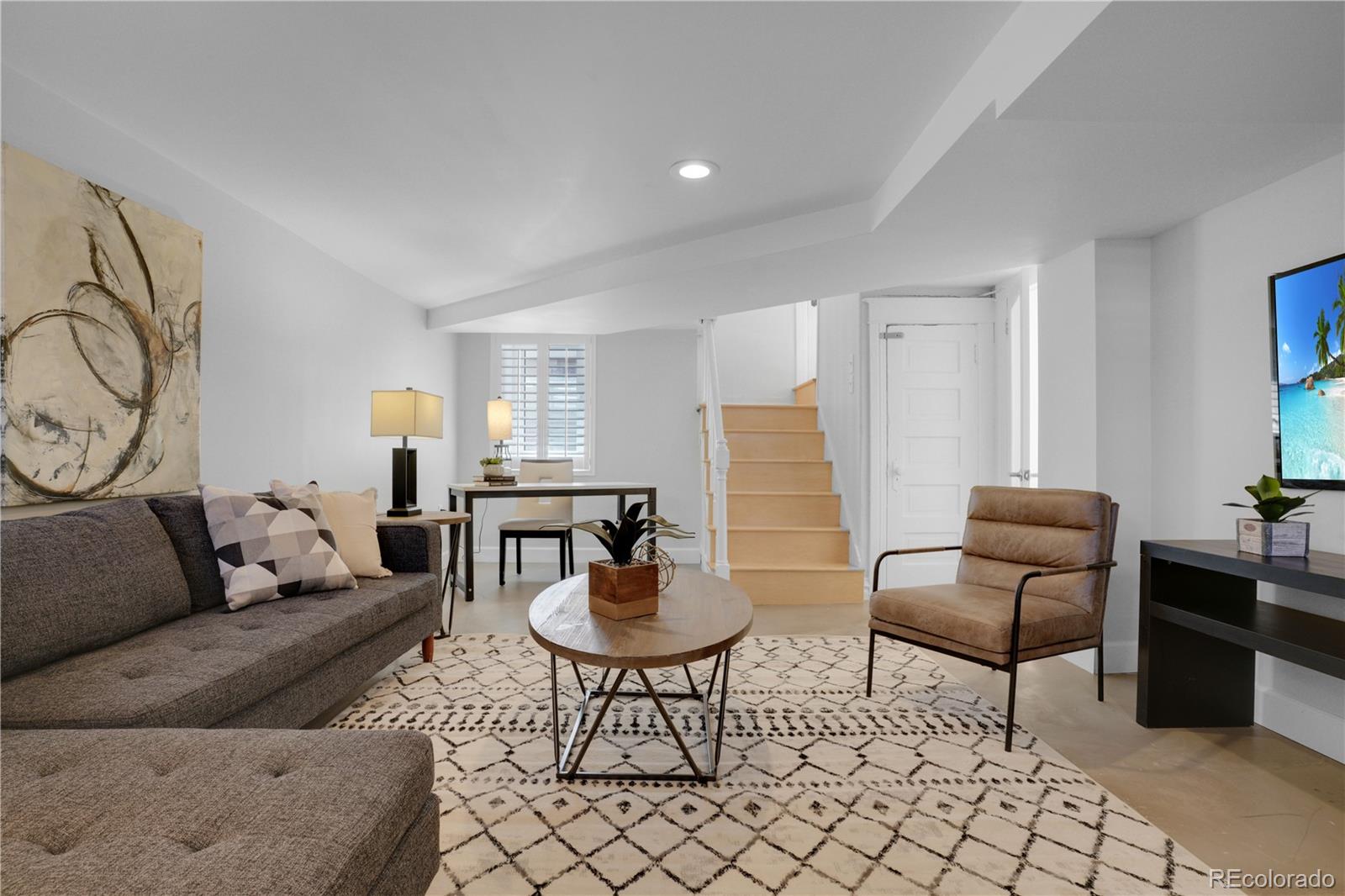 1283 Madison Street Denver, CO 80206 - Photo 24 of 34 a living room with furniture and a potted plant