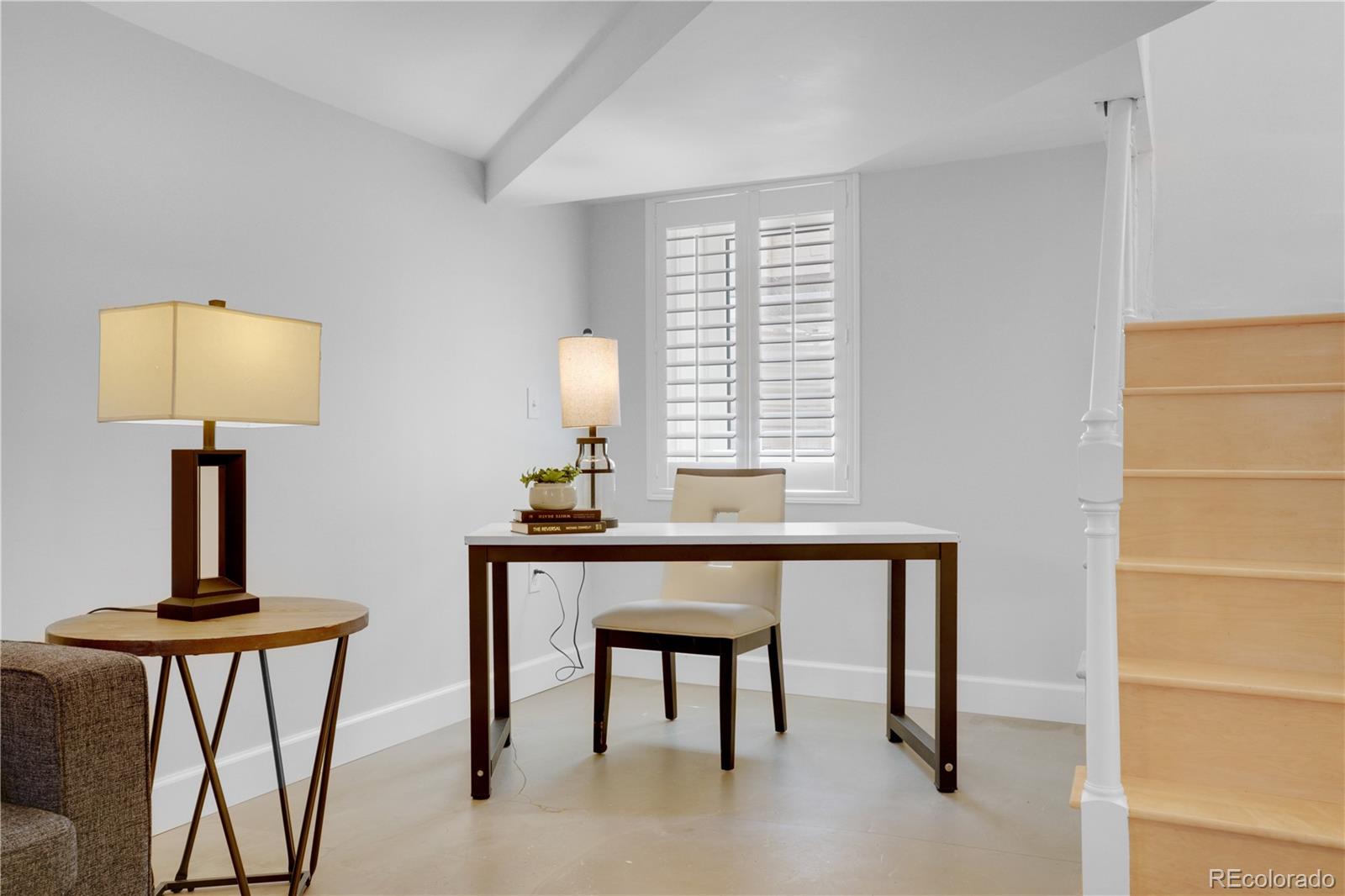 1283 Madison Street Denver, CO 80206 - Photo 25 of 34 a view of a workspace with furniture and a window