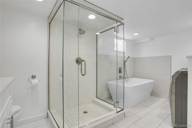 a bathroom with a shower and a sink
