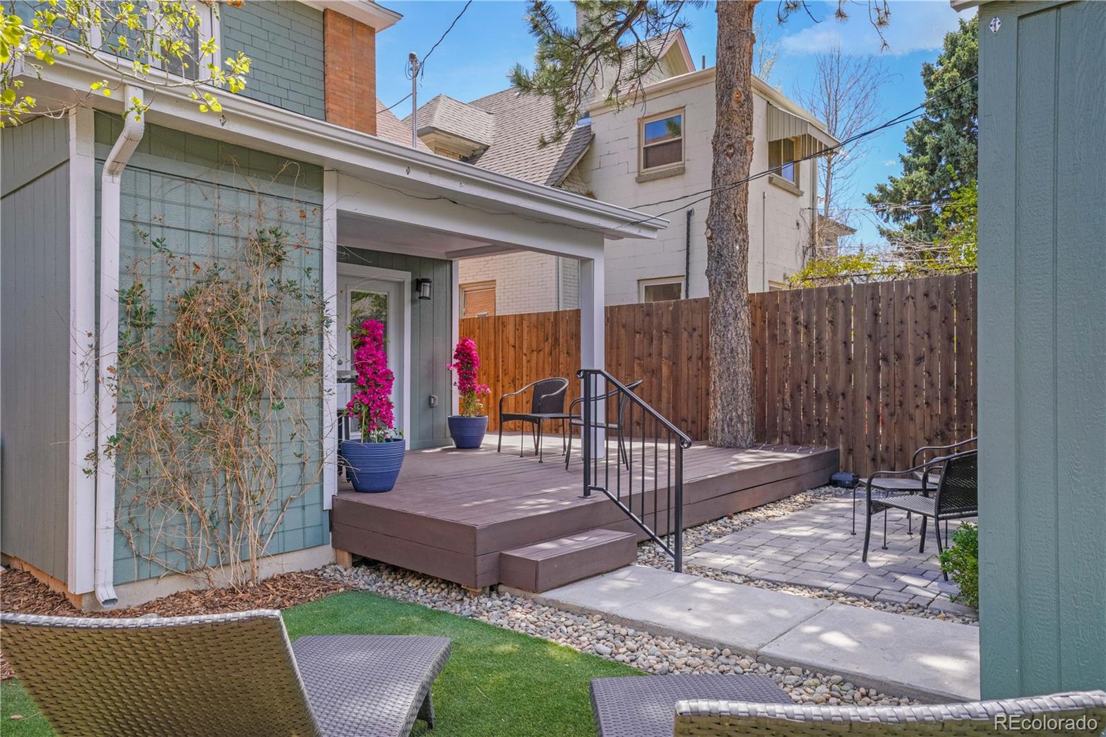 1283 Madison Street Denver, CO 80206 - Photo 31 of 34 a view of a patio with table and chairs