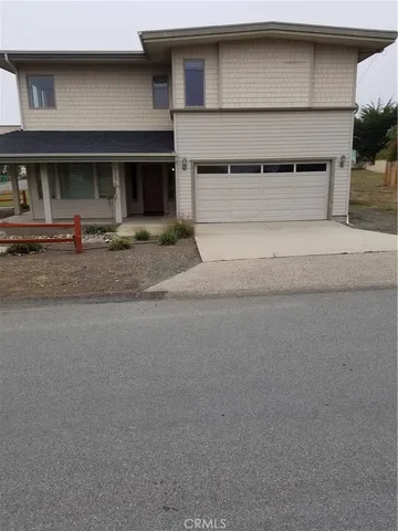 a front view of a house with garage