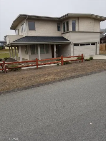 a view of a white house with a large windows