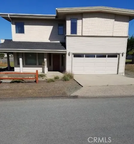 a front view of a house with garage
