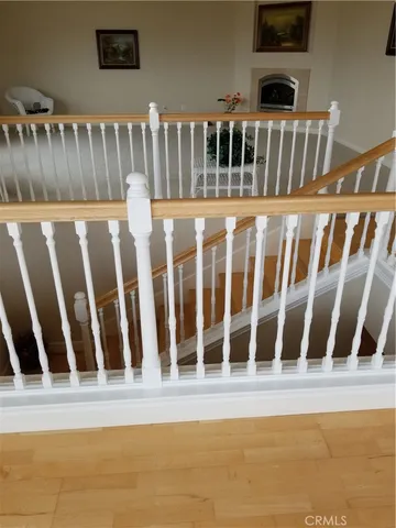 a black white house with a wooden fence