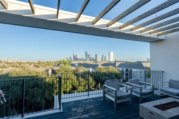 a view of a balcony with furniture
