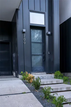 a front view of building with yard