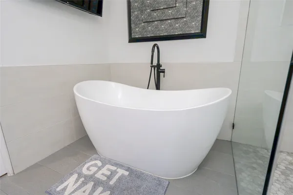 a bathroom with a double vanity sink and mirror