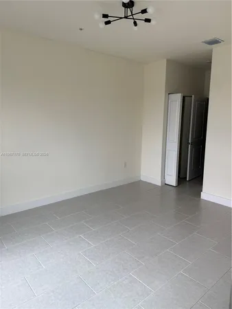 a kitchen with stainless steel appliances a sink a stove a microwave and cabinets