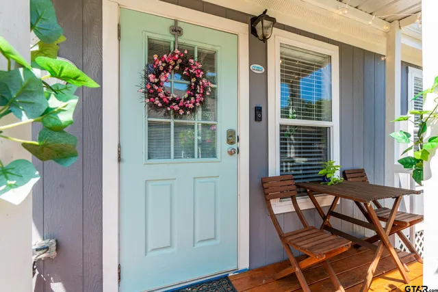 a view of balcony with furniture and garden