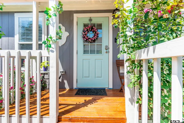 a view of a chairs in back of the house