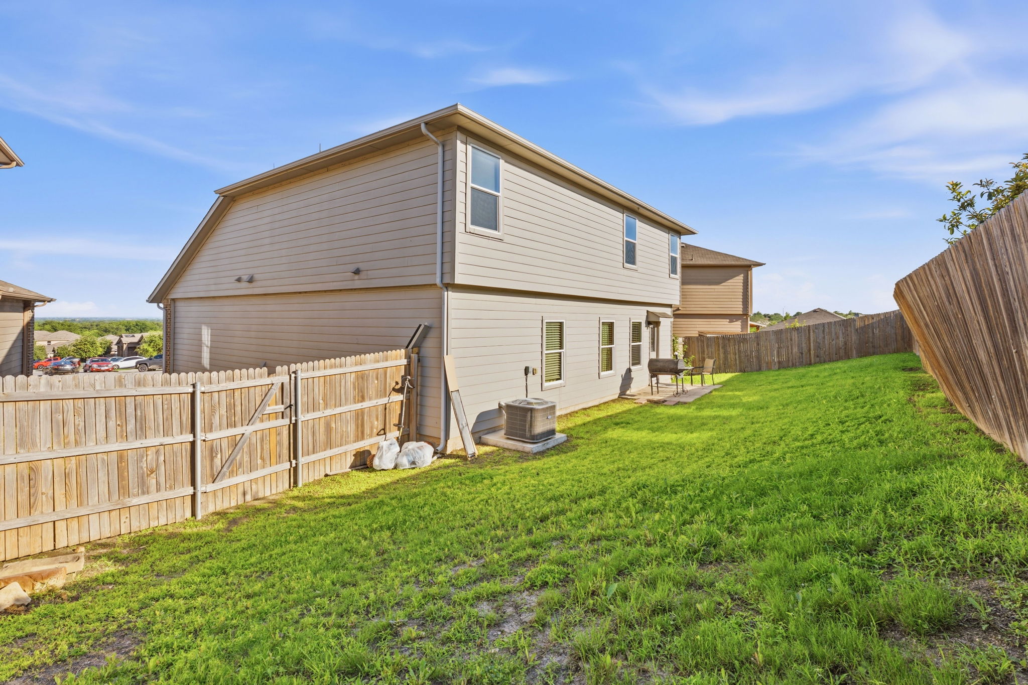 15101 Shell Bark Cove Austin, TX 78724 - Photo 26 of 26 Two-story residential structure featuring light-toned siding and multiple windows