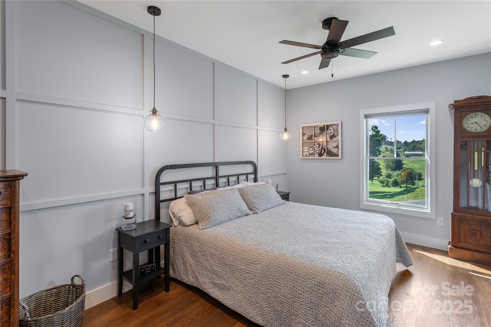 100 Kinloch Lane Clyde, NC 28721 - Photo 12 of 39 a bedroom with a large bed and a window