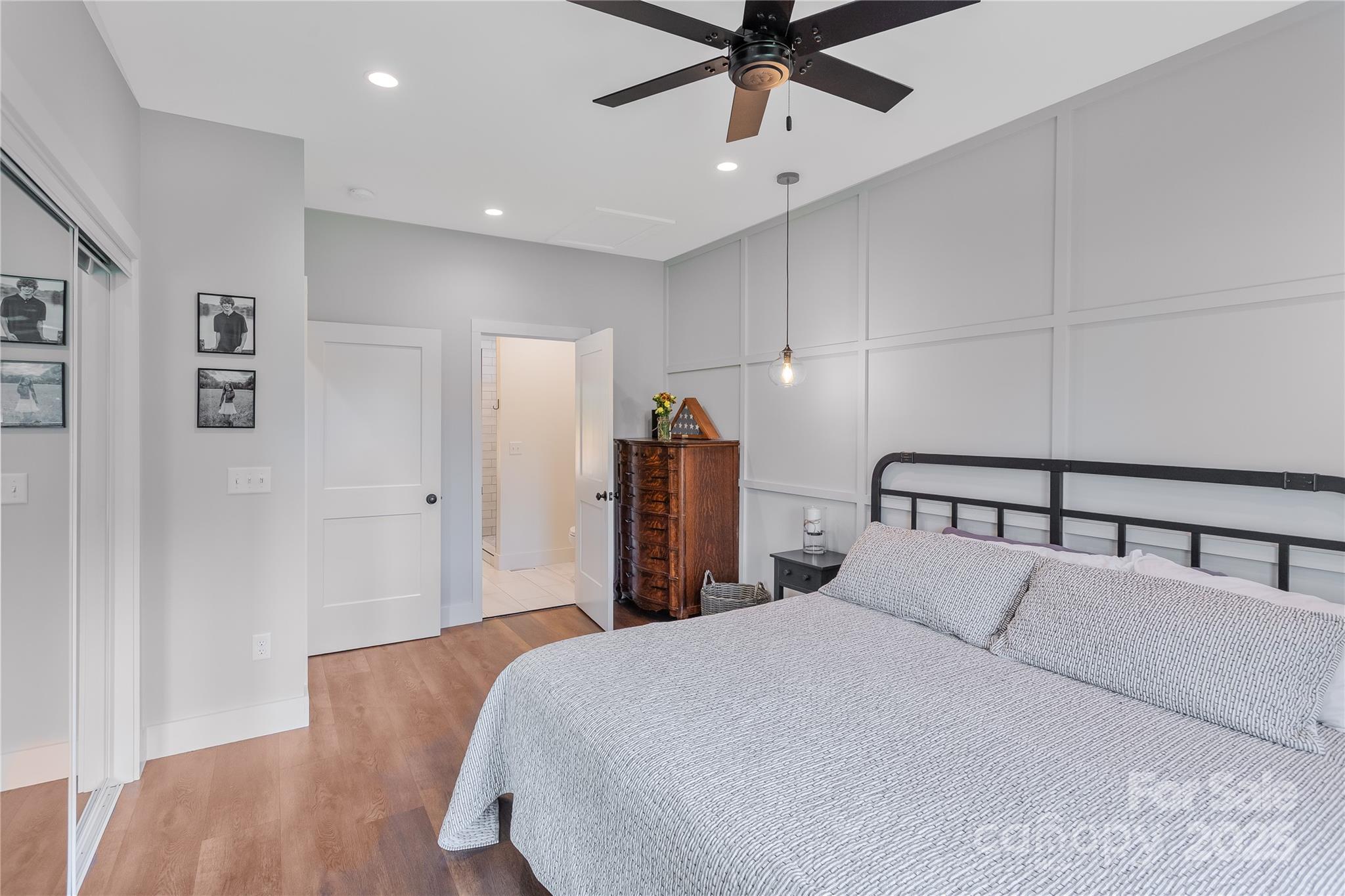 100 Kinloch Lane Clyde, NC 28721 - Photo 13 of 39 a bedroom with a bed and a ceiling fan