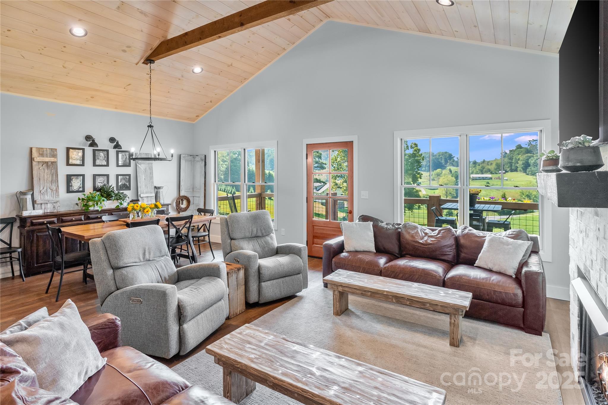 100 Kinloch Lane Clyde, NC 28721 - Photo 2 of 39 a living room with furniture kitchen view and large windows