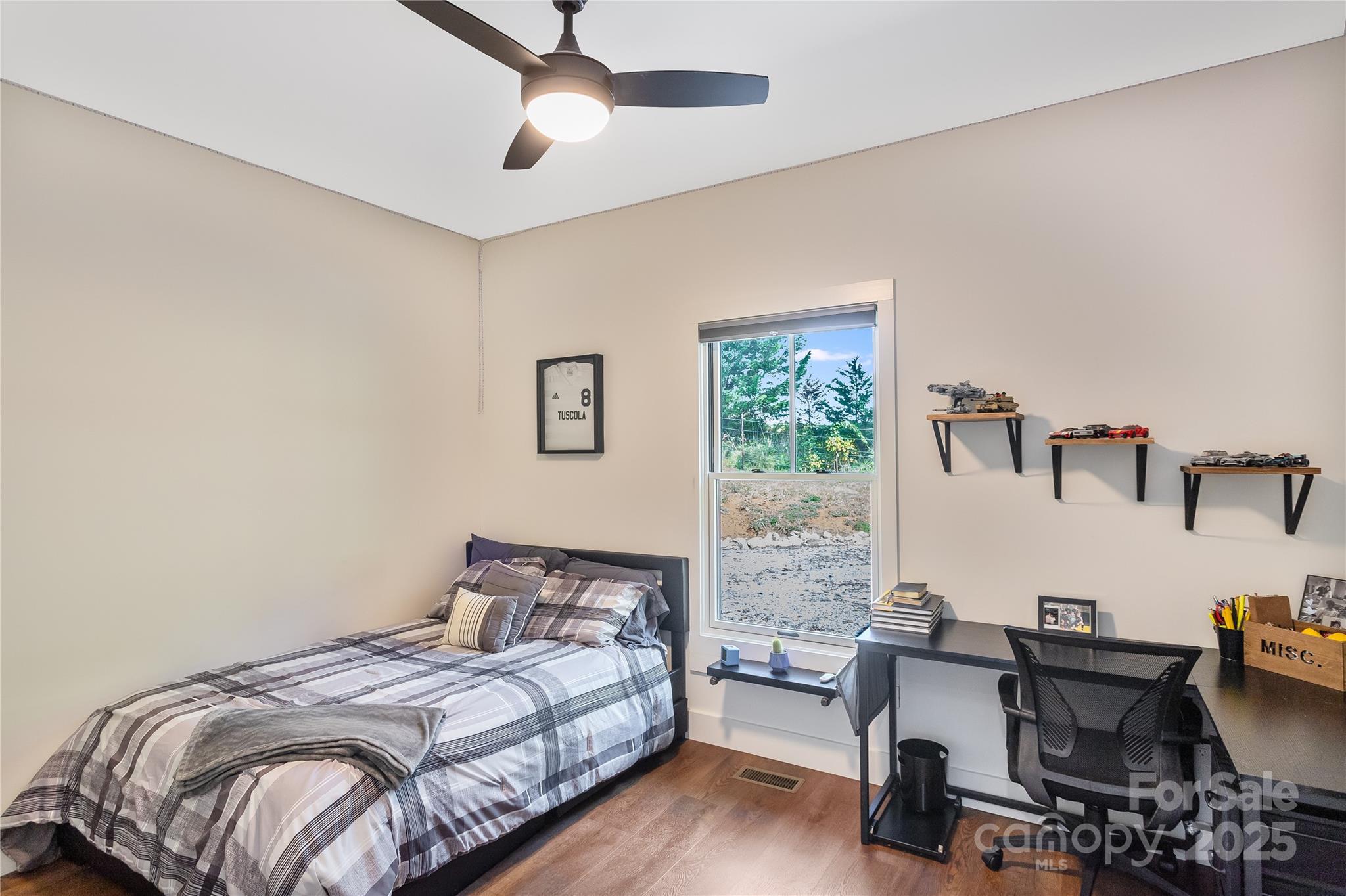 100 Kinloch Lane Clyde, NC 28721 - Photo 23 of 39 a bedroom with a bed and a desk