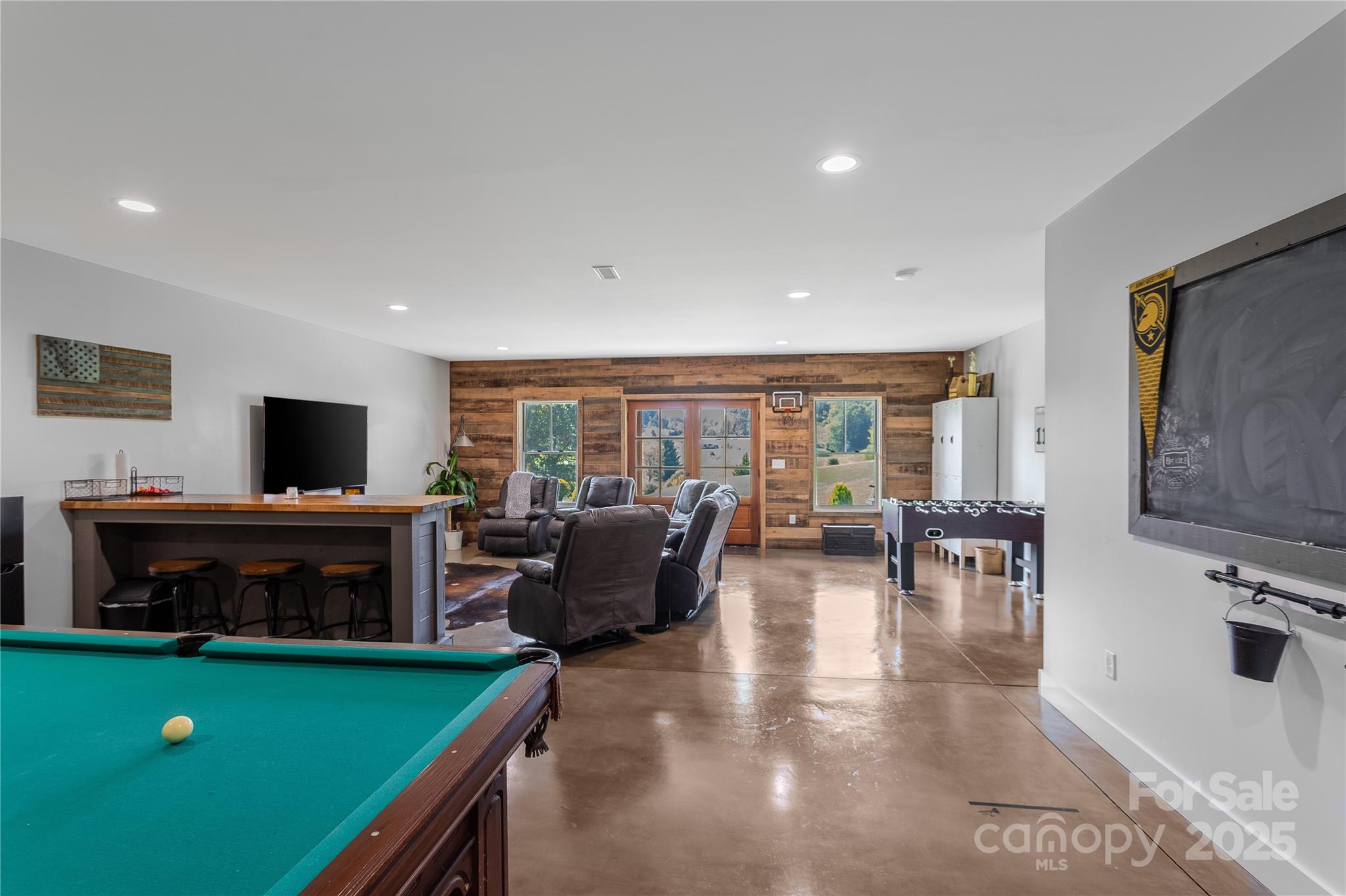 100 Kinloch Lane Clyde, NC 28721 - Photo 25 of 39 a living room with fireplace furniture and a flat screen tv