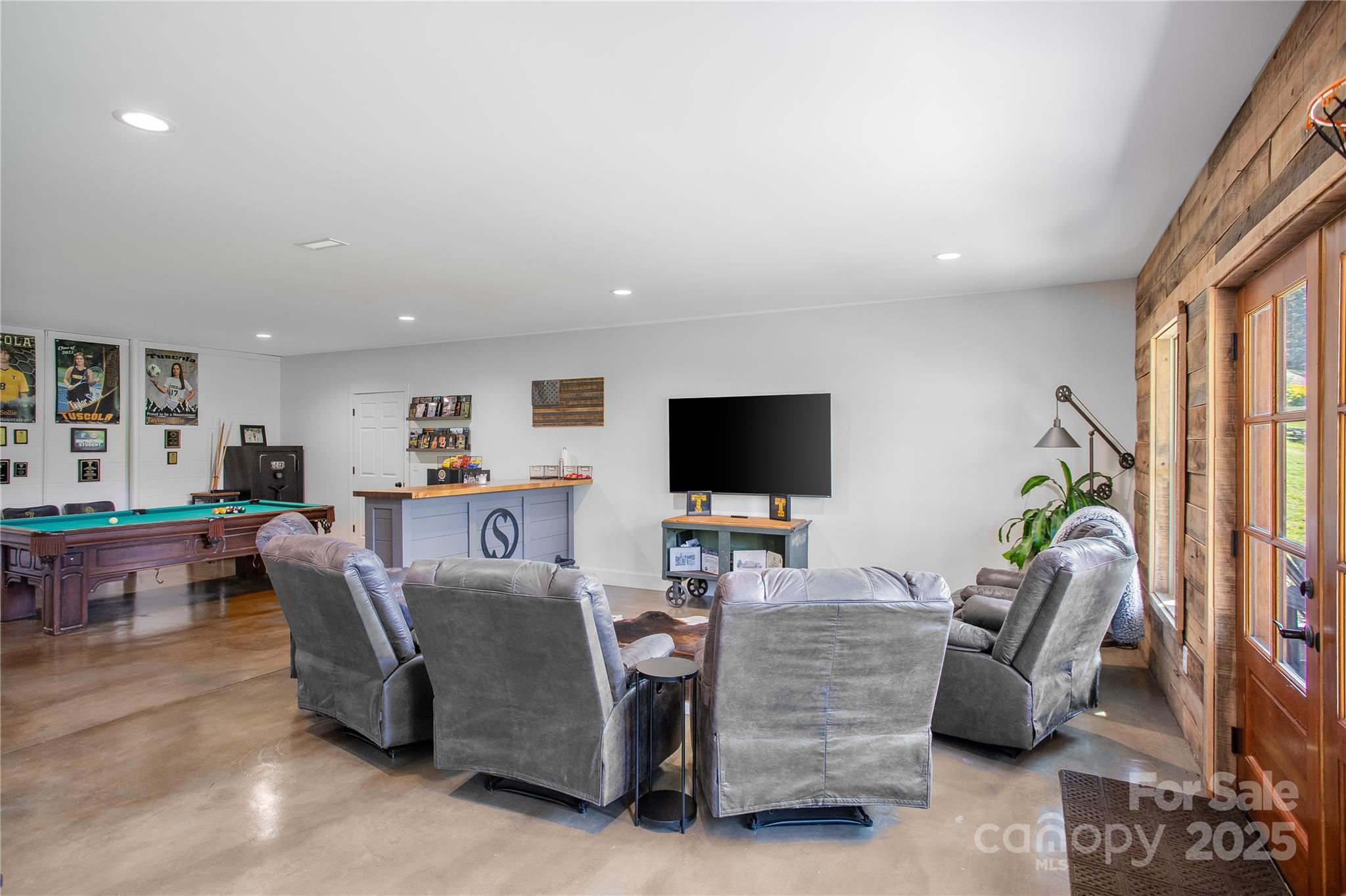 100 Kinloch Lane Clyde, NC 28721 - Photo 28 of 39 a living room with furniture and a flat screen tv