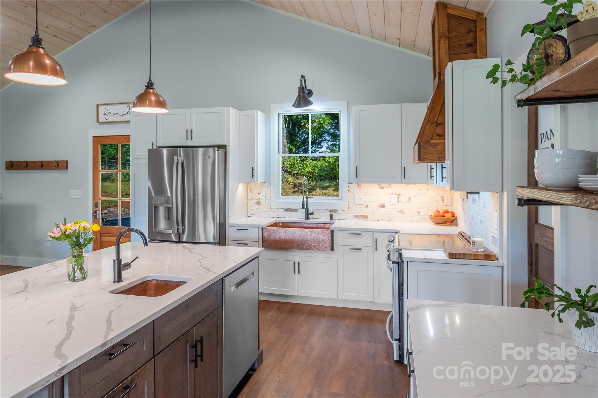 100 Kinloch Lane Clyde, NC 28721 - Photo 4 of 39 a kitchen with a sink stove and wooden floor
