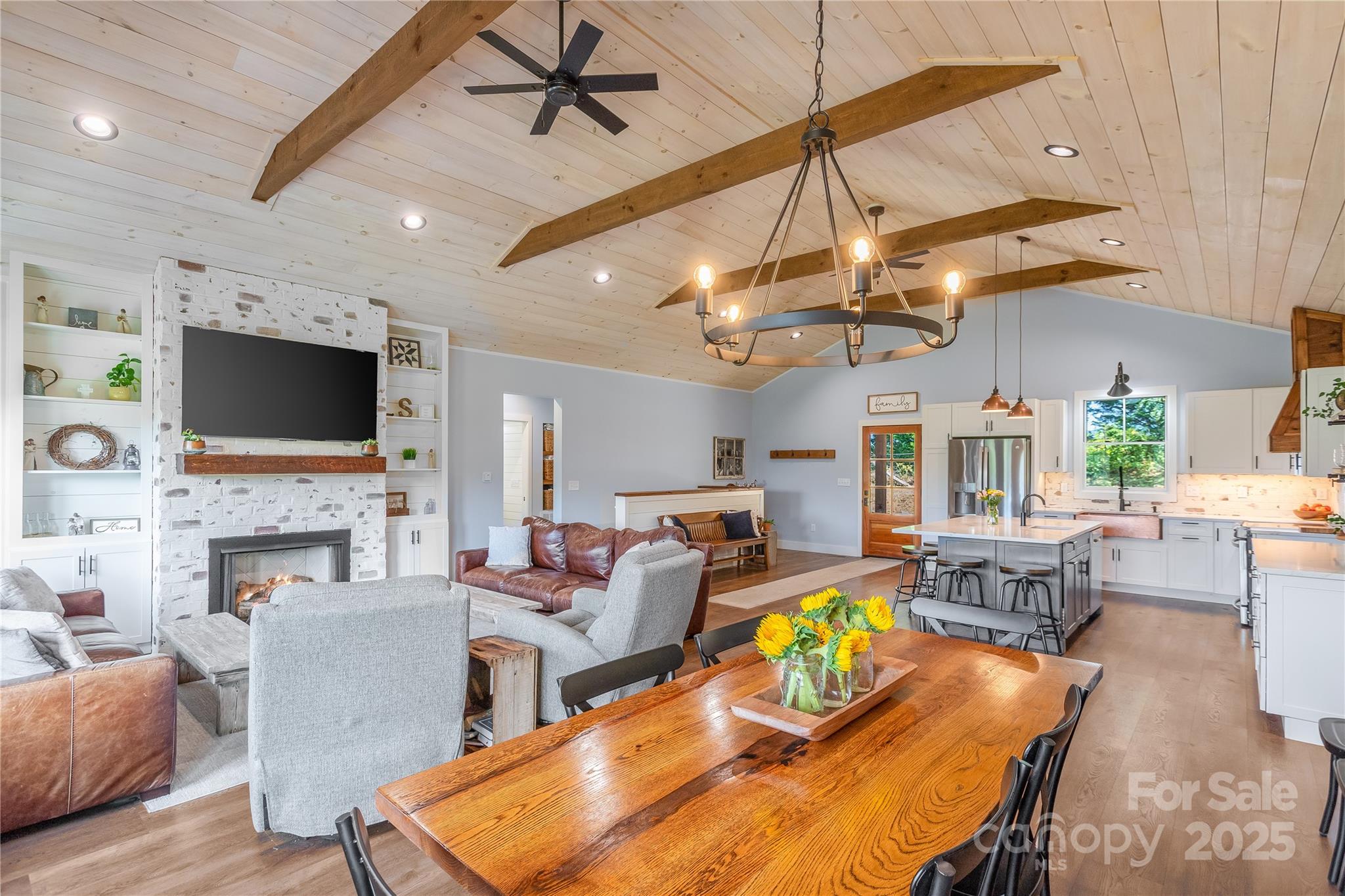 100 Kinloch Lane Clyde, NC 28721 - Photo 10 of 39 a living room with fireplace furniture and a flat screen tv