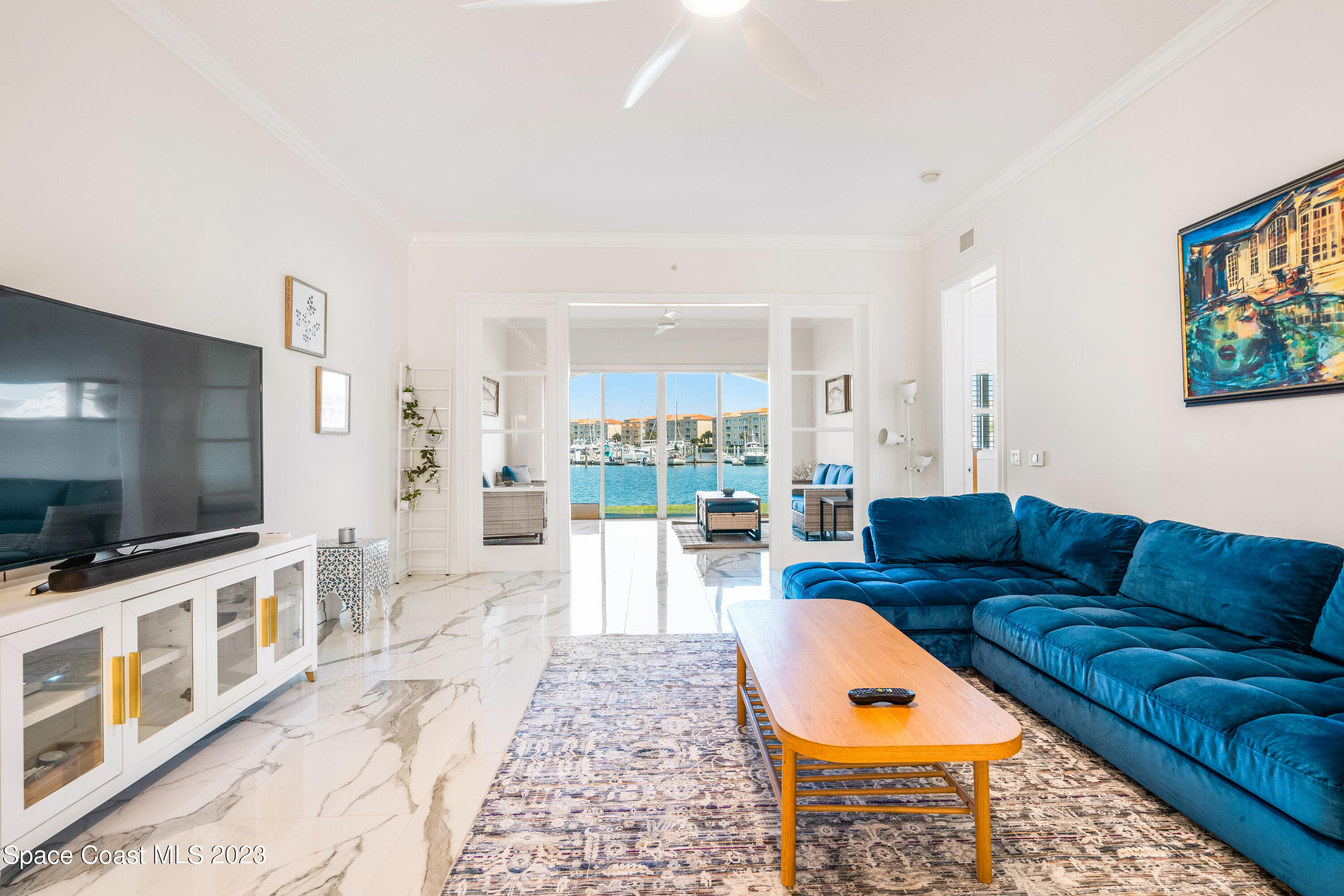 Undisclosed Address Fort Pierce, FL 34949 - Photo 11 of 36 a living room with furniture and a flat screen tv