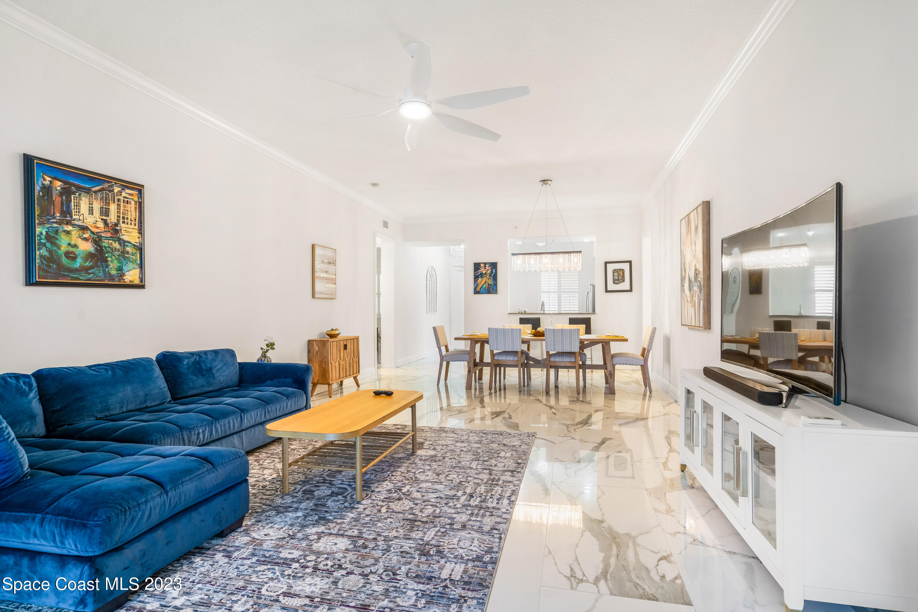 Undisclosed Address Fort Pierce, FL 34949 - Photo 13 of 36 a living room with furniture and a flat screen tv