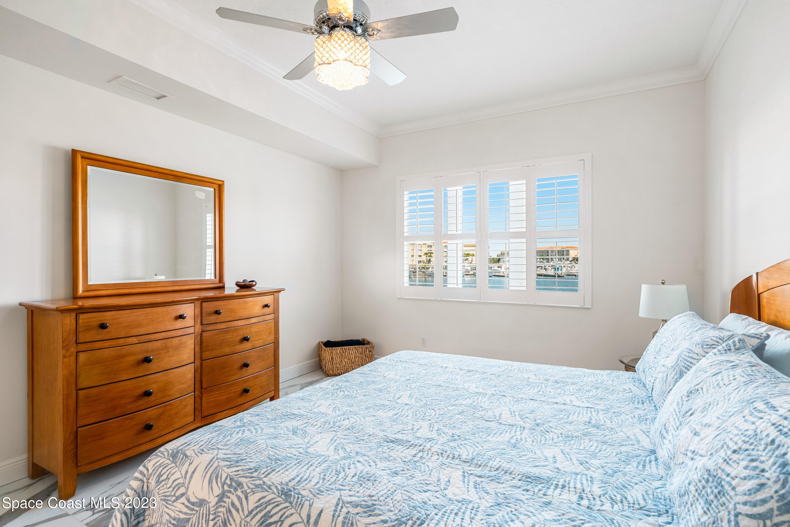 Undisclosed Address Fort Pierce, FL 34949 - Photo 19 of 36 a bedroom with a bed and a mirror on dresser