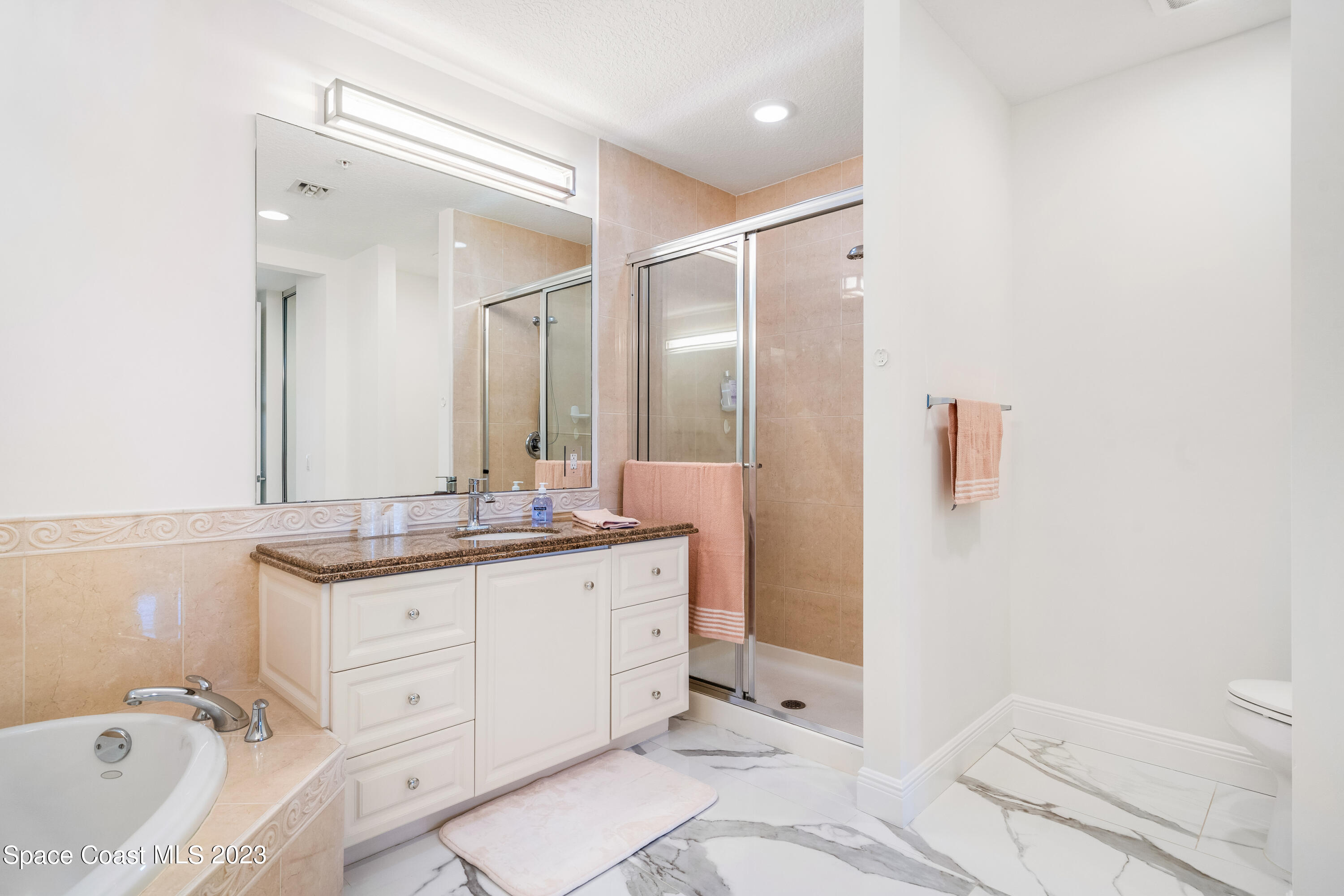 Undisclosed Address Fort Pierce, FL 34949 - Photo 22 of 36 a bathroom with a granite countertop sink toilet and shower