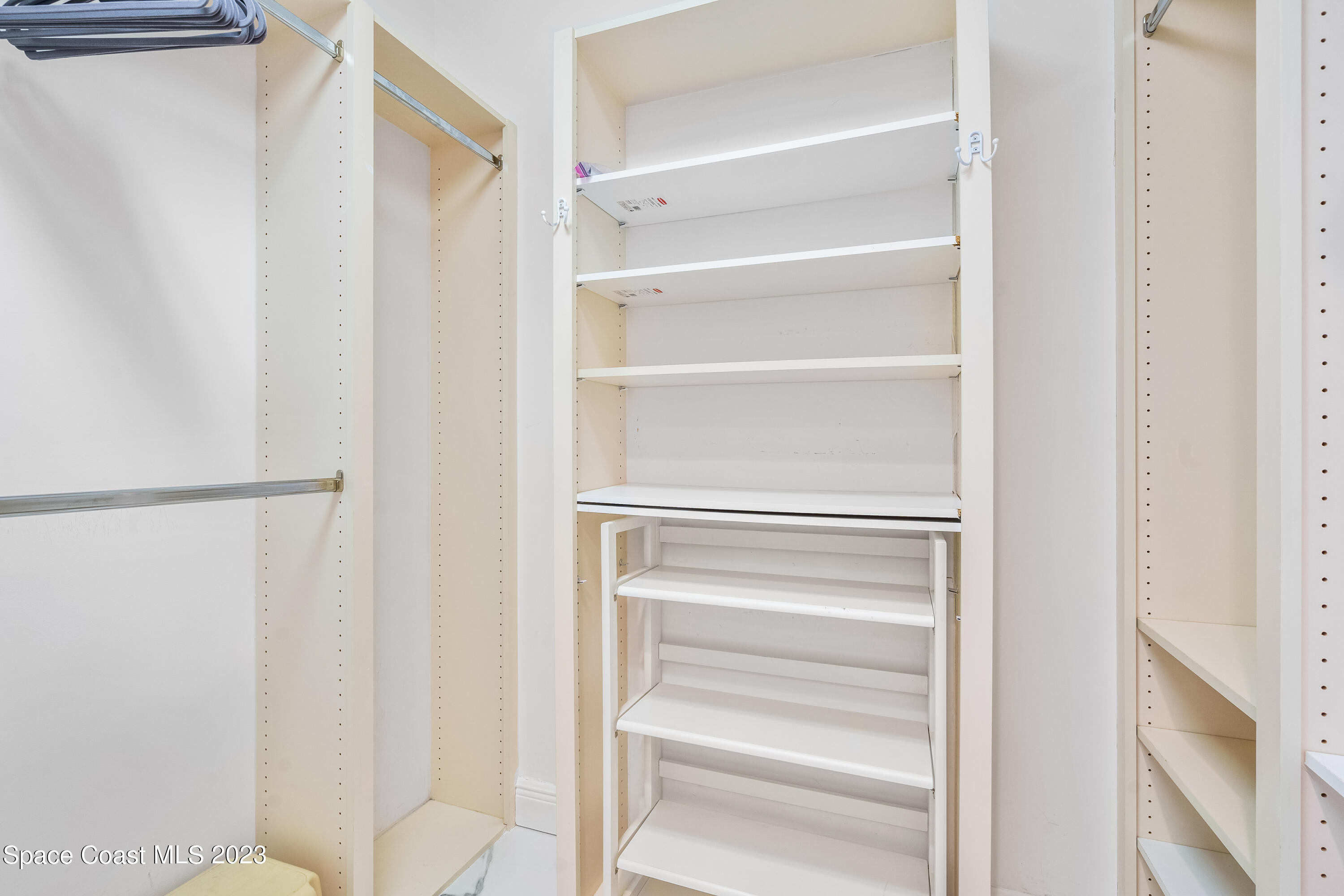 Undisclosed Address Fort Pierce, FL 34949 - Photo 23 of 36 a view of walk in closet with empty racks