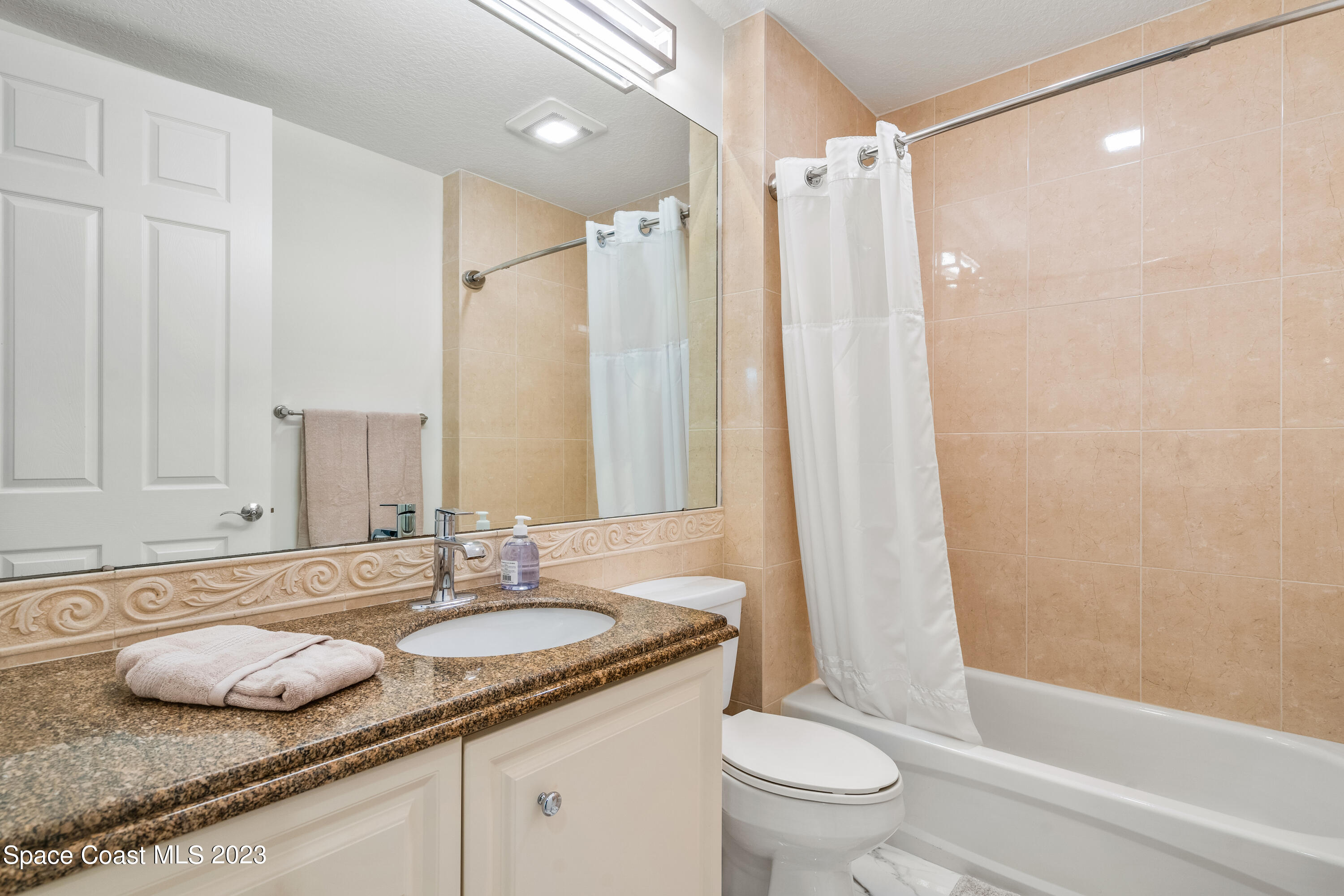 Undisclosed Address Fort Pierce, FL 34949 - Photo 26 of 36 a bathroom with a granite countertop sink toilet and shower