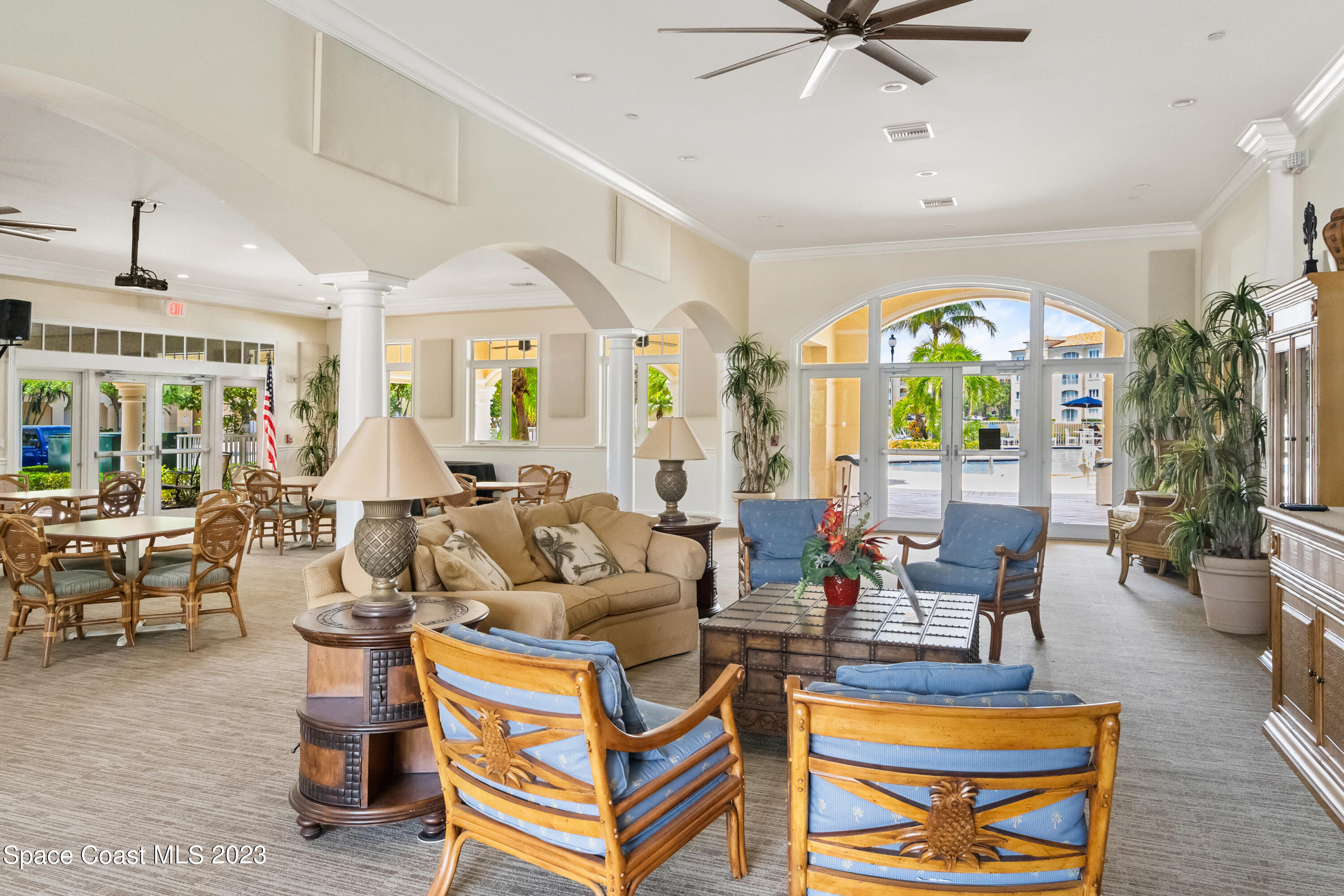 Undisclosed Address Fort Pierce, FL 34949 - Photo 32 of 36 a living room with furniture a chandelier and a dining table