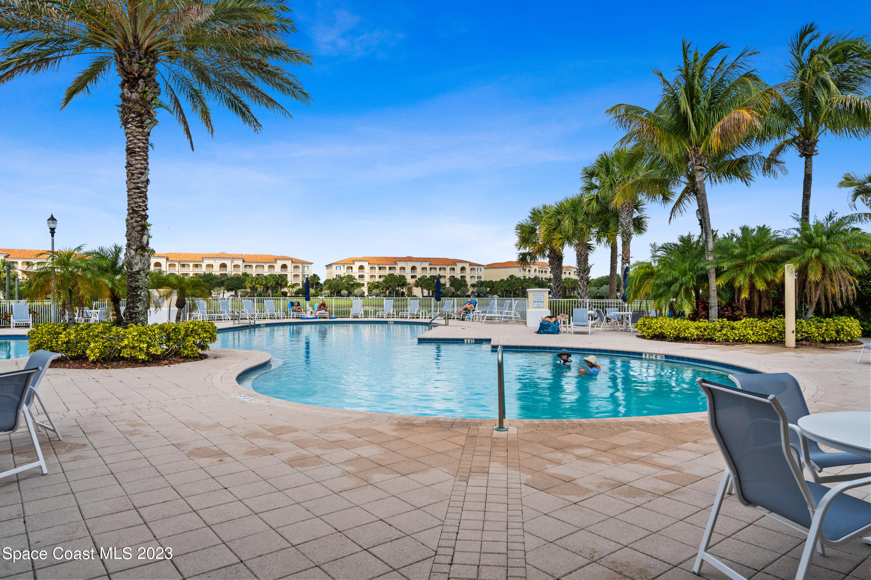 Undisclosed Address Fort Pierce, FL 34949 - Photo 36 of 36 a view of a swimming pool with a table and chairs