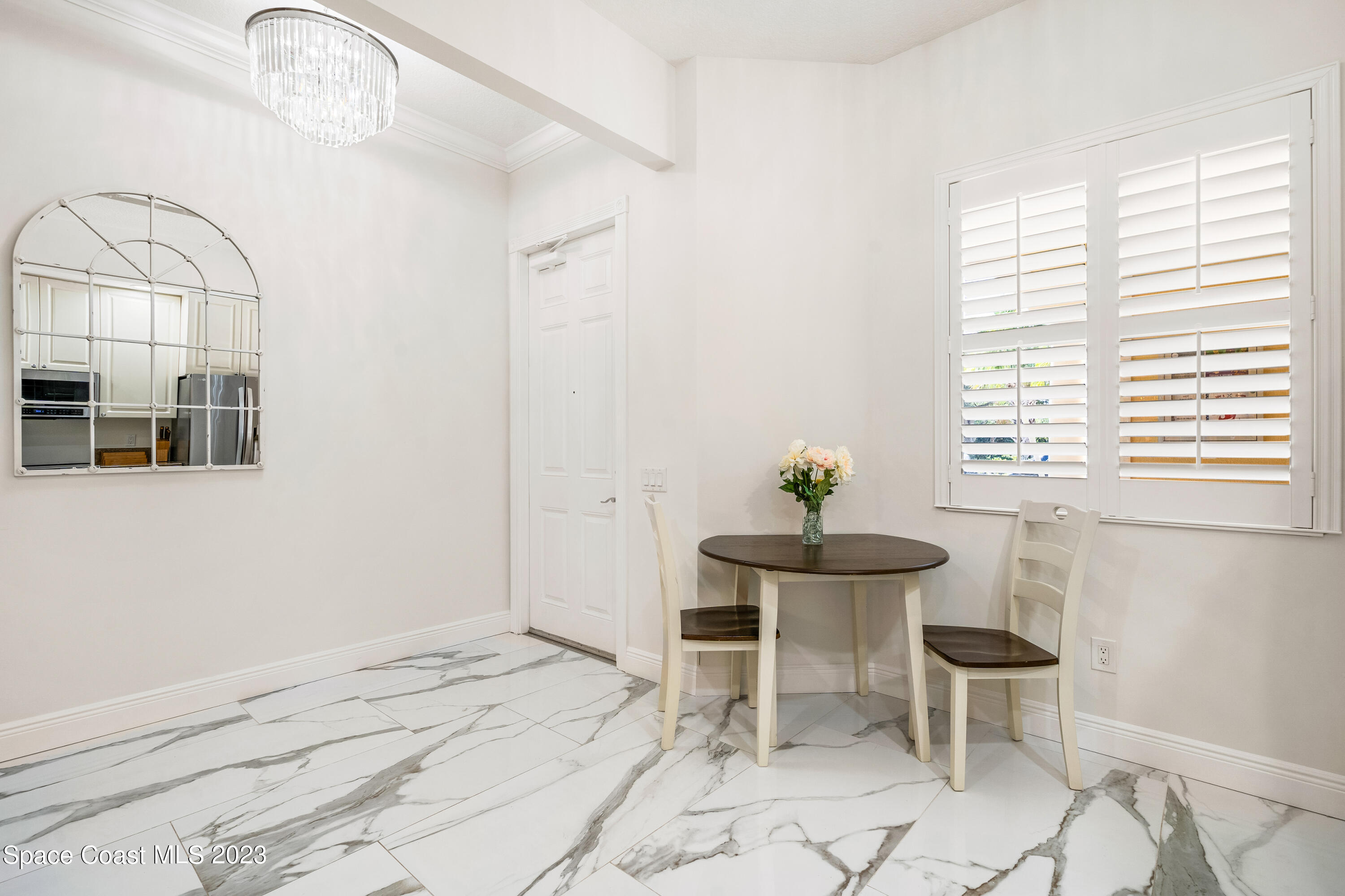 Undisclosed Address Fort Pierce, FL 34949 - Photo 8 of 36 a room with a chair and a window