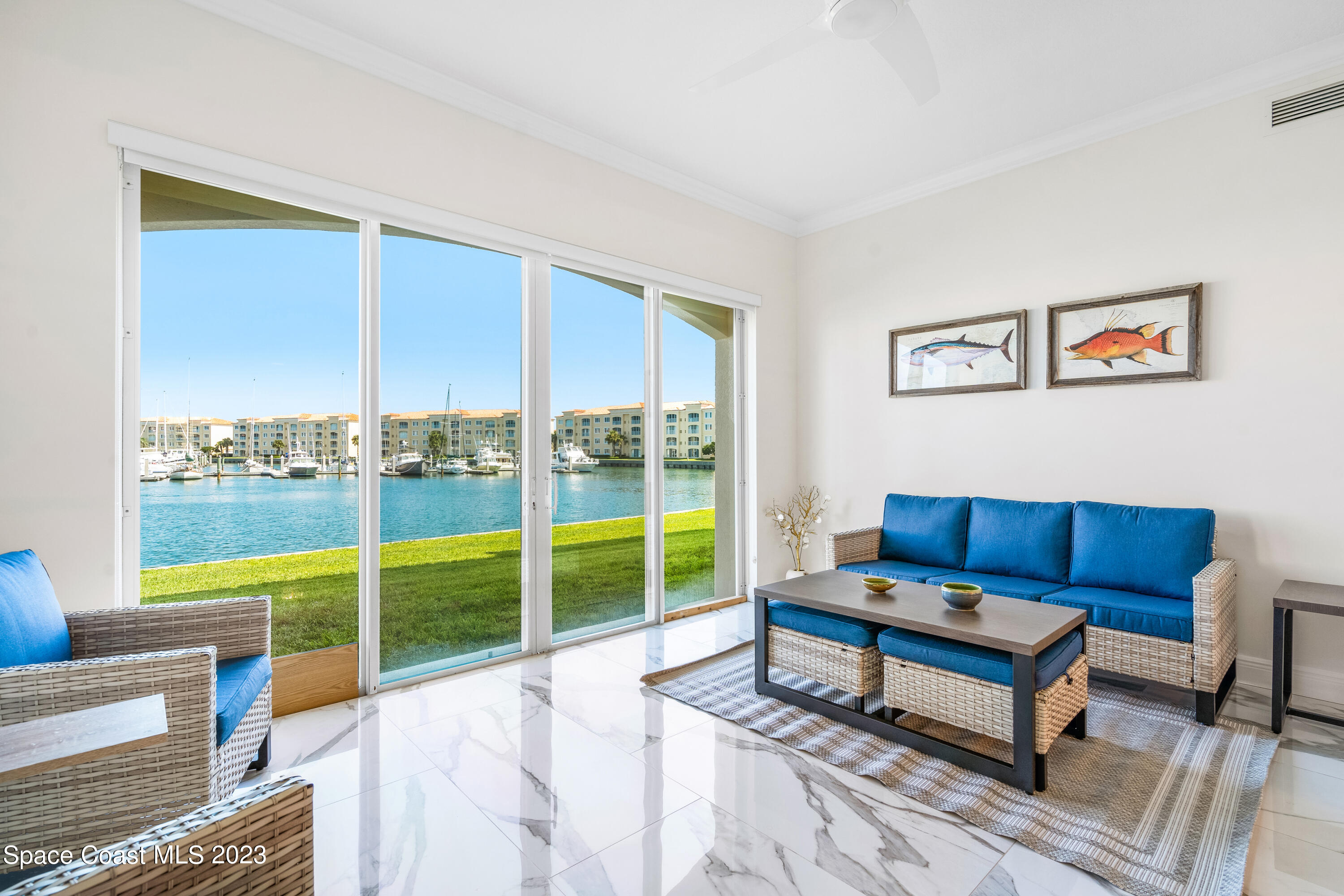 Undisclosed Address Fort Pierce, FL 34949 - Photo 9 of 36 a living room with furniture and a floor to ceiling window