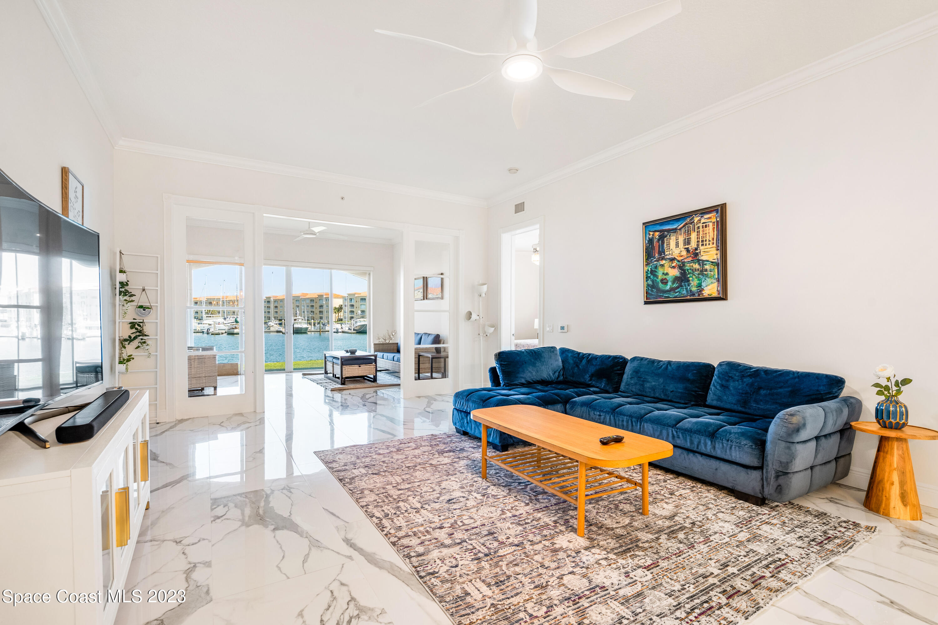 Undisclosed Address Fort Pierce, FL 34949 - Photo 10 of 36 a living room with furniture a rug and a flat screen tv