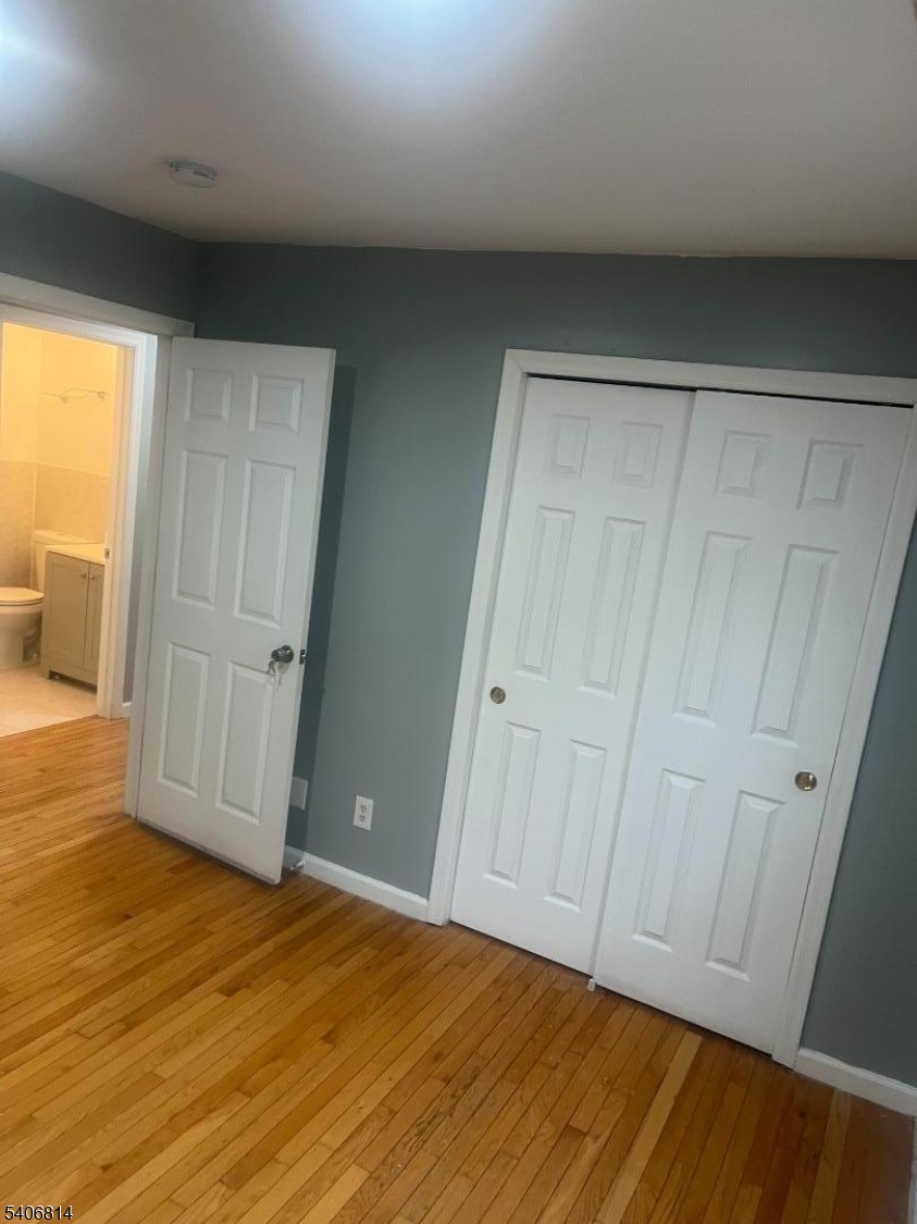 710 27th Street Union City, NJ 07087 - Photo 9 of 22 a view of an empty room with wooden floor and a window